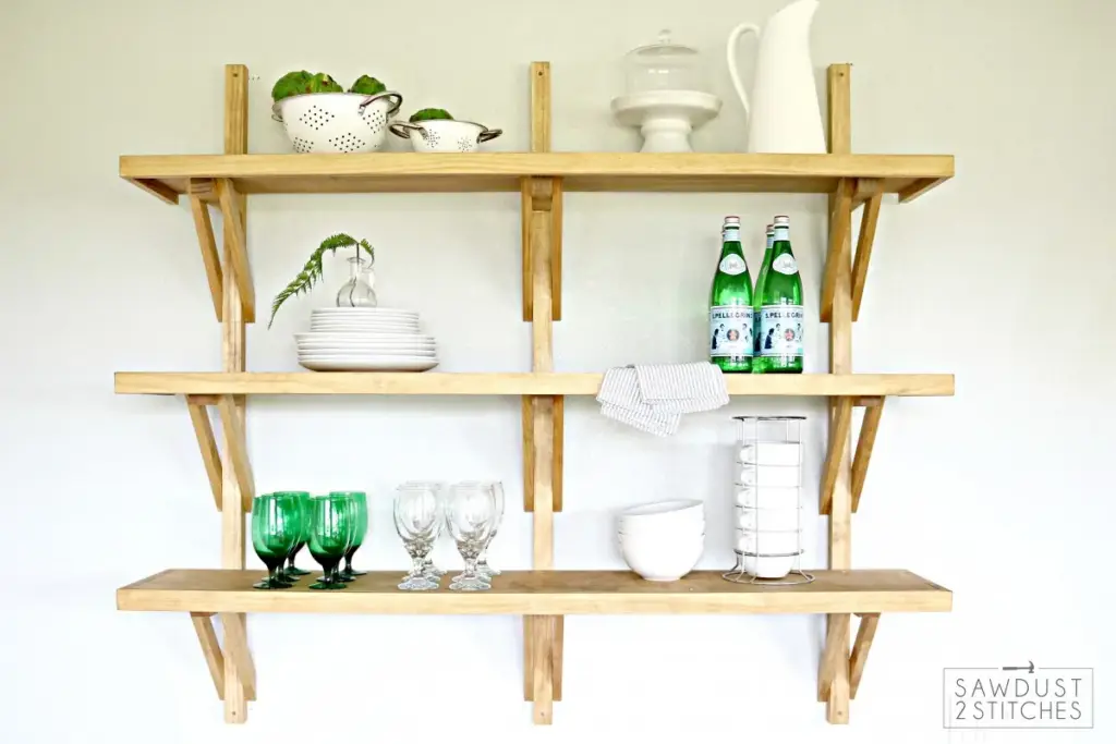 Wall-mounted bracket open shelving unit made from pine, 48 inches wide with multiple shelves.